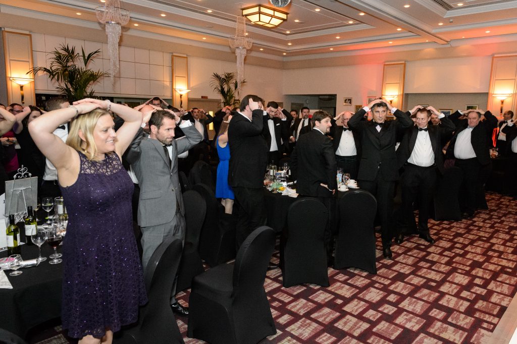 Gala Dinner attendees participate in a game to raise more money for the charity
