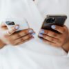 Shadow AI personal accounts: an employee holding a personal phone and a work phone