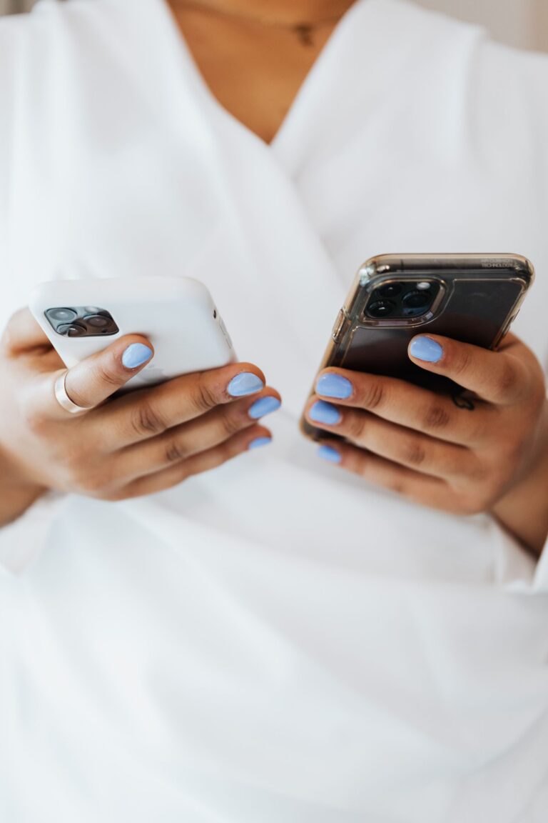 Shadow AI personal accounts: an employee holding a personal phone and a work phone